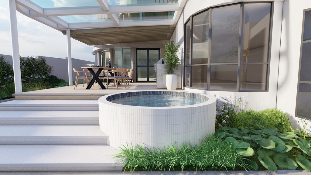 Inviting beige two-story home with a wide concrete driveway, attached garage, and beautiful front yard landscaping.