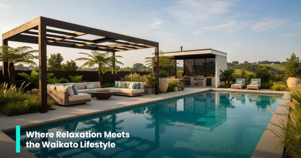 Hamilton custom pool with concrete deck, lush landscaping, and an outdoor lounge area.